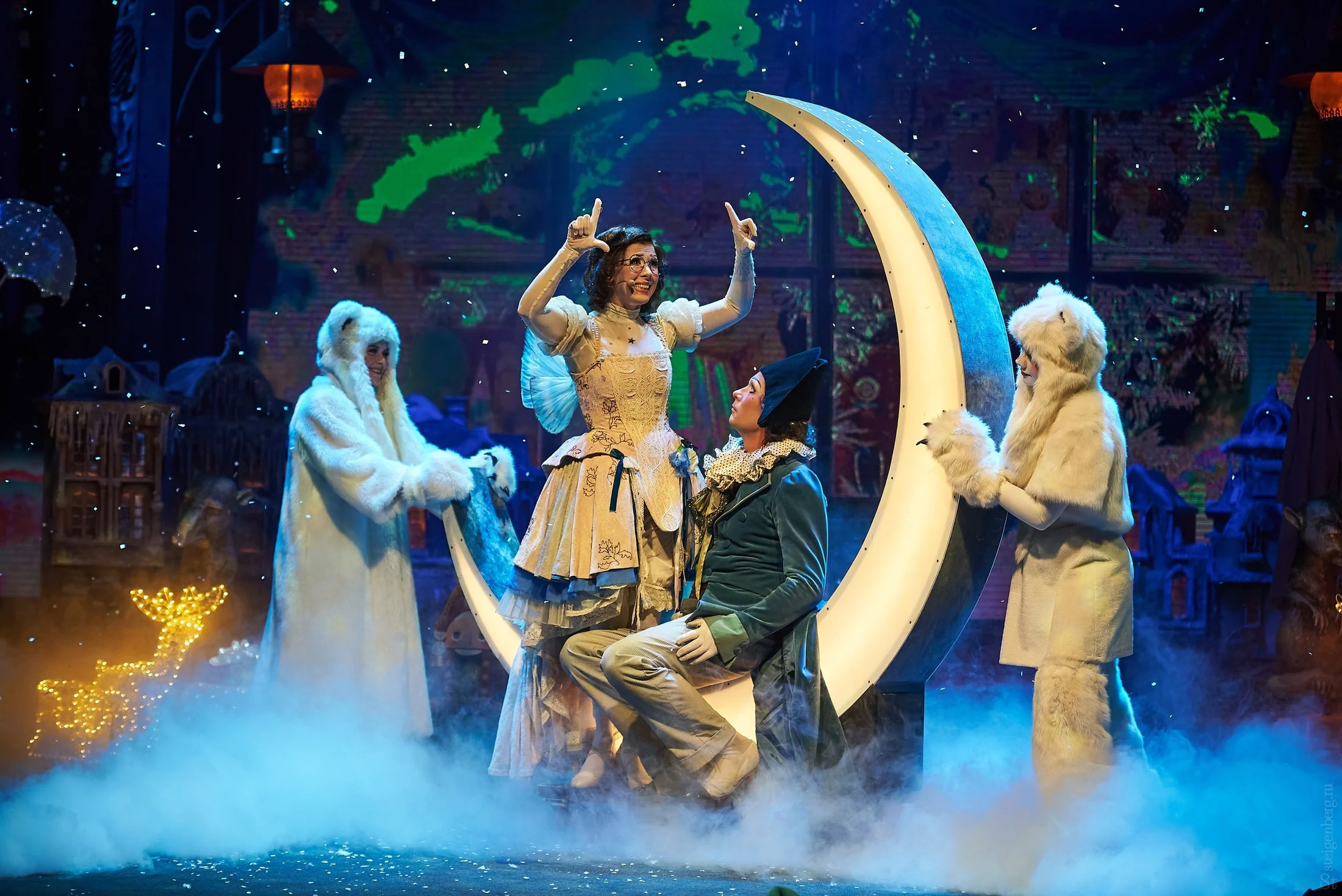 Performer beneath a moon-shaped light in theatrical fog