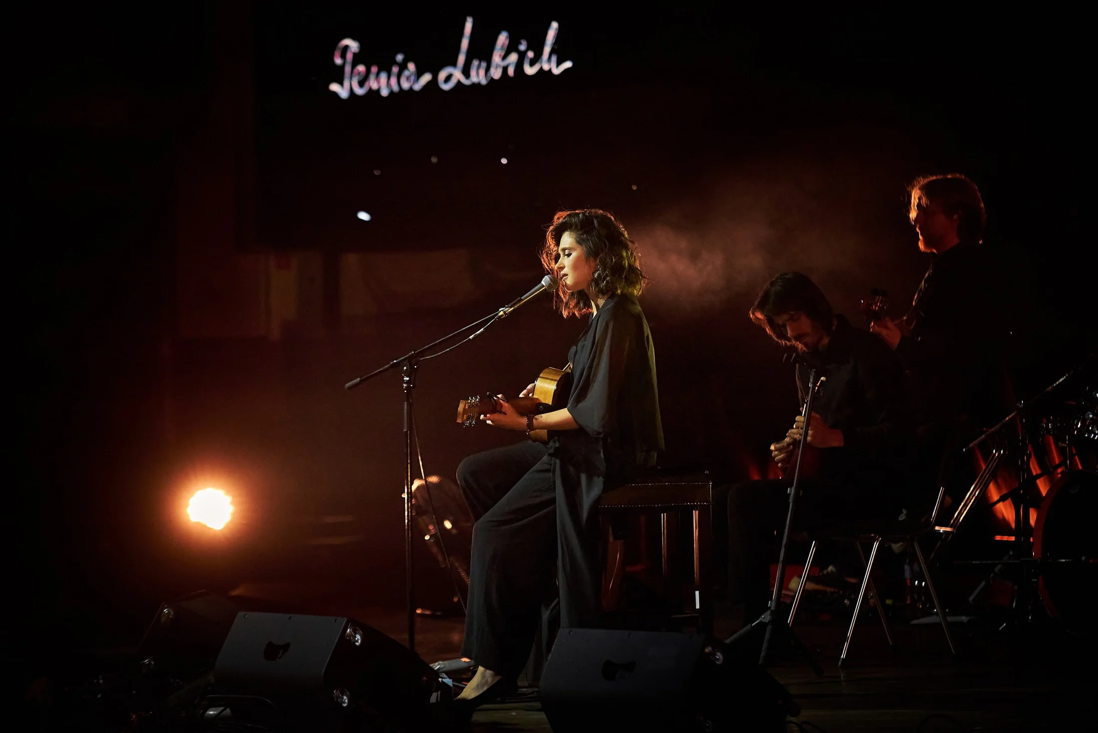 Musician performing in warm concert light