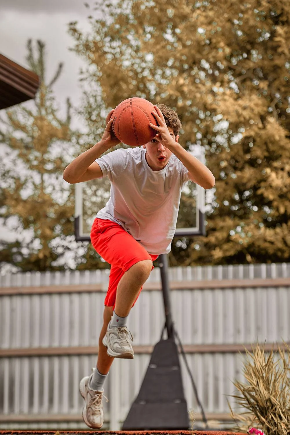 Portrait of a basketball player in motion with a ball